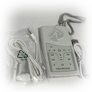 The In Touch Messenger with its earbuds and USB charging cable
